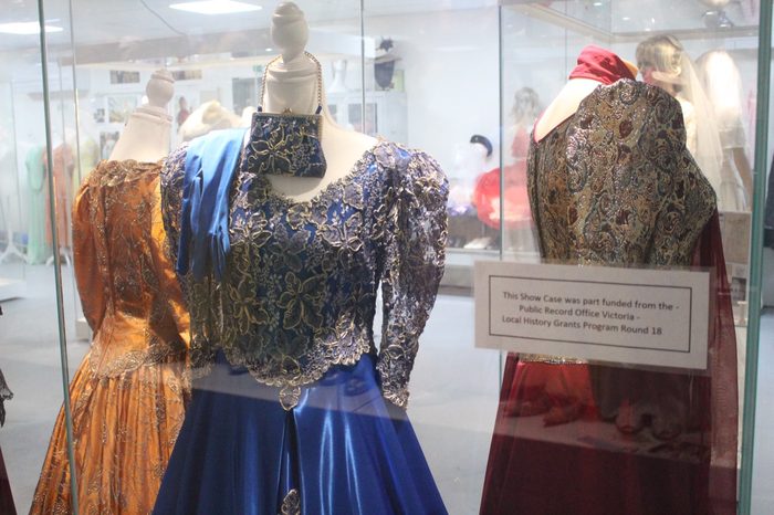 Beaded evening dresses in orange and deep blue