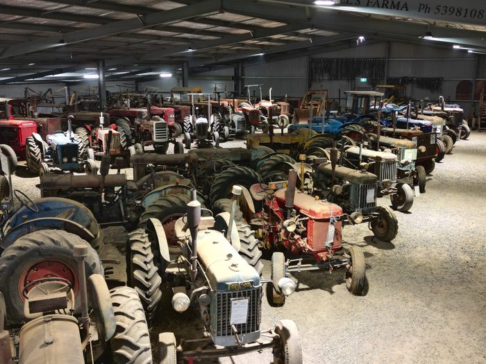 Tractors lined up down the length of the shed