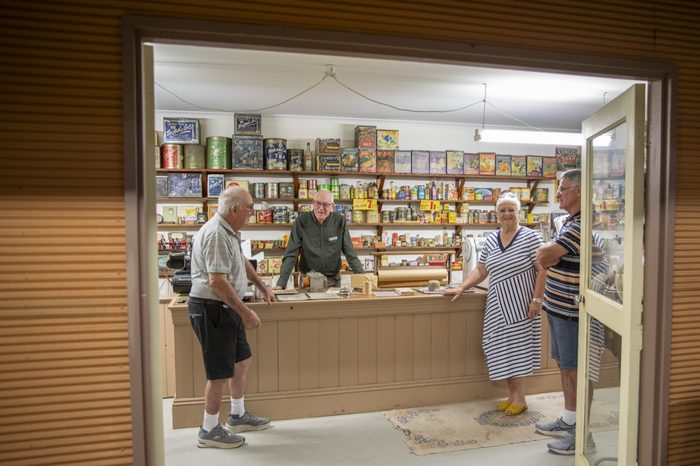 A shop window stocked with vintage tins and packets