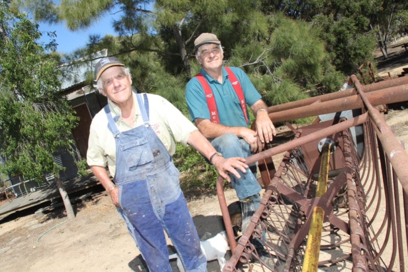 The Woods family beside machinery at the original farm