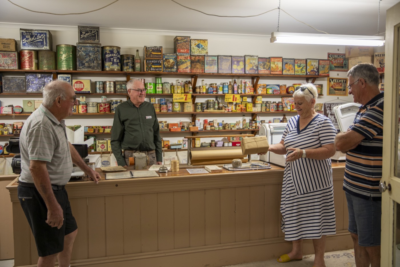 Visitors at the counter of the recreated grocery shop